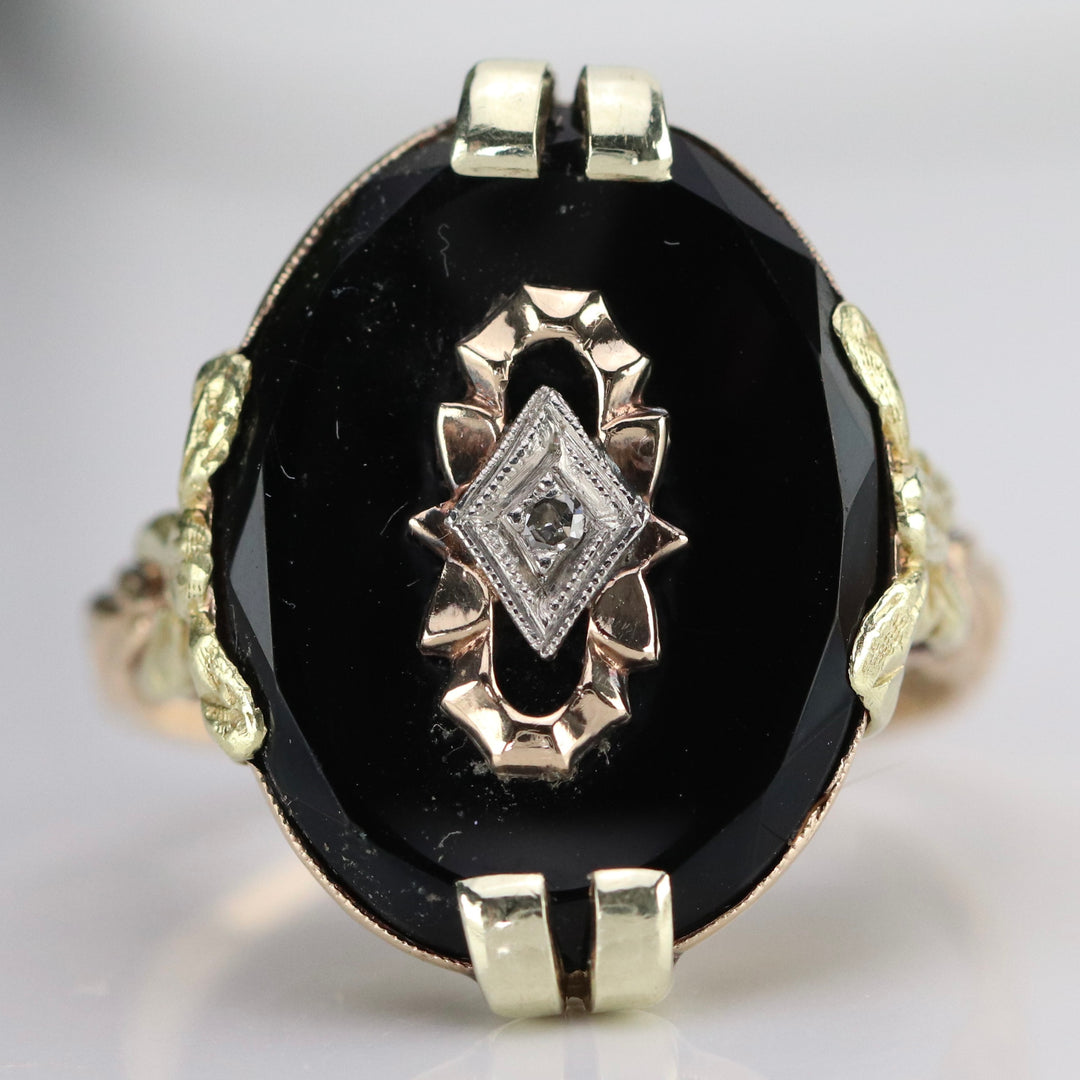 Vintage onyx and diamond ring in yellow gold