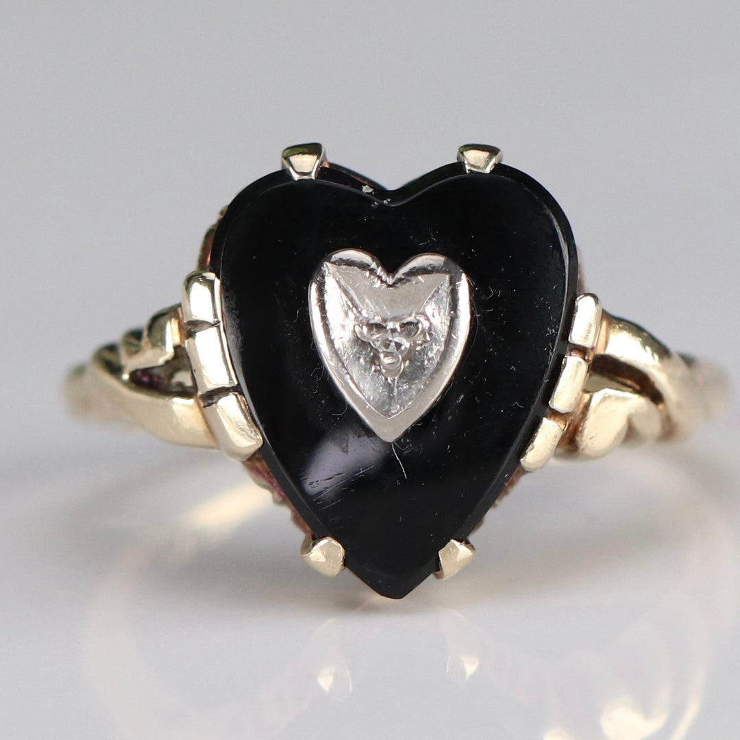 Heart shaped onyx and diamond ring in yellow gold