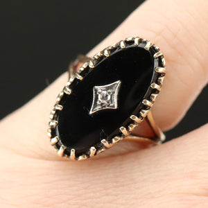 Classic vintage onyx and diamond ring in yellow gold