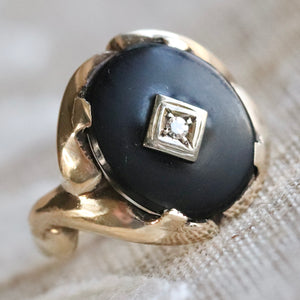 Vintage oval onyx and diamond ring in yellow gold