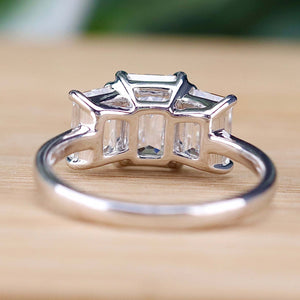 MANOR ROYAL:  The Charlotte - 3 stone 3.03ctw lab grown emerald cut diamond ring in platinum