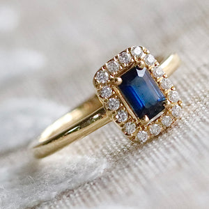 Sapphire and diamond halo ring in 14k yellow gold