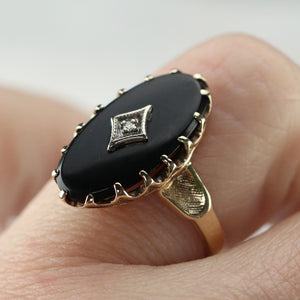 Classic vintage onyx and diamond ring in yellow gold