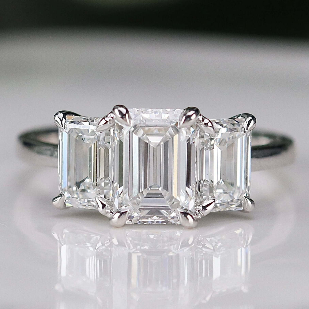 SPECIAL: MANOR ROYAL:  The Charlotte - 3 stone 3.03ctw lab grown emerald cut diamond ring in platinum