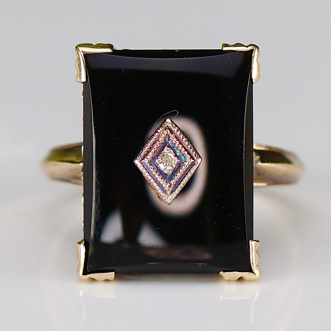 Vintage onyx and diamond ring in yellow gold