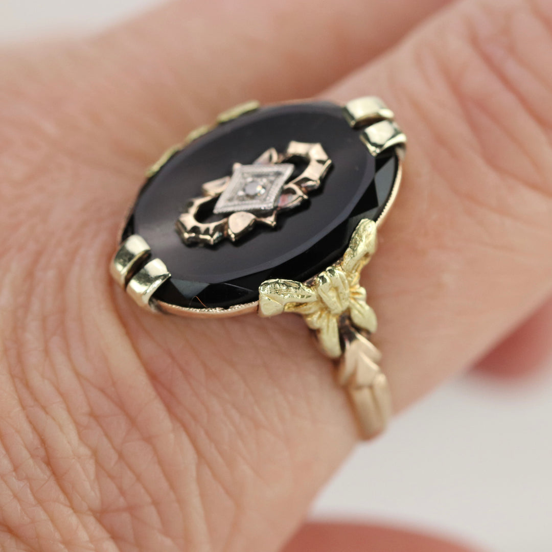 Vintage onyx and diamond ring in yellow gold