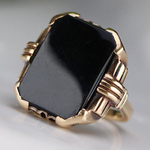 Heavy vintage onyx ring in yellow gold