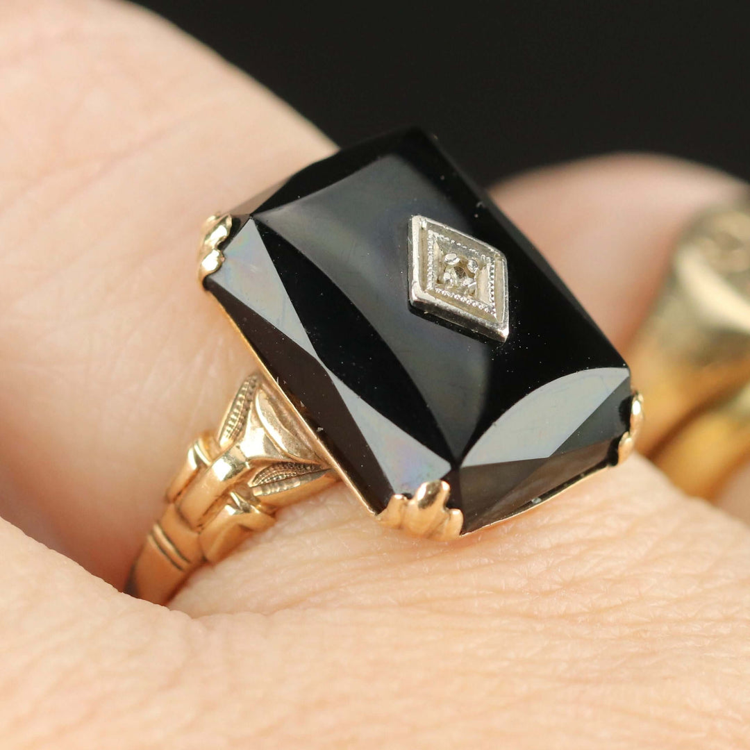 Vintage faceted Onyx and diamond ring in yellow gold