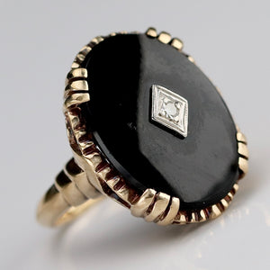 Large oval vintage black onyx and diamond ring in yellow gold ring