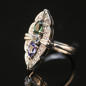 Estate platinum navette ring with diamonds, aquamarine, tanzanite, and tourmaline in platinum from Manor Jewels