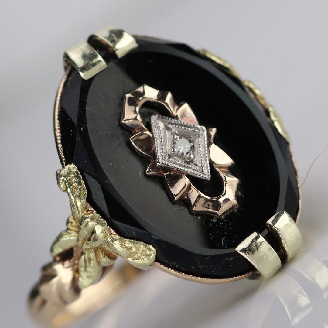 Vintage onyx and diamond ring in yellow gold