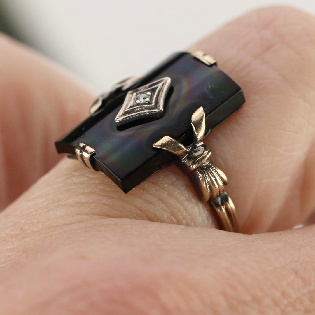 Vintage curved onyx and diamond ring in yellow gold