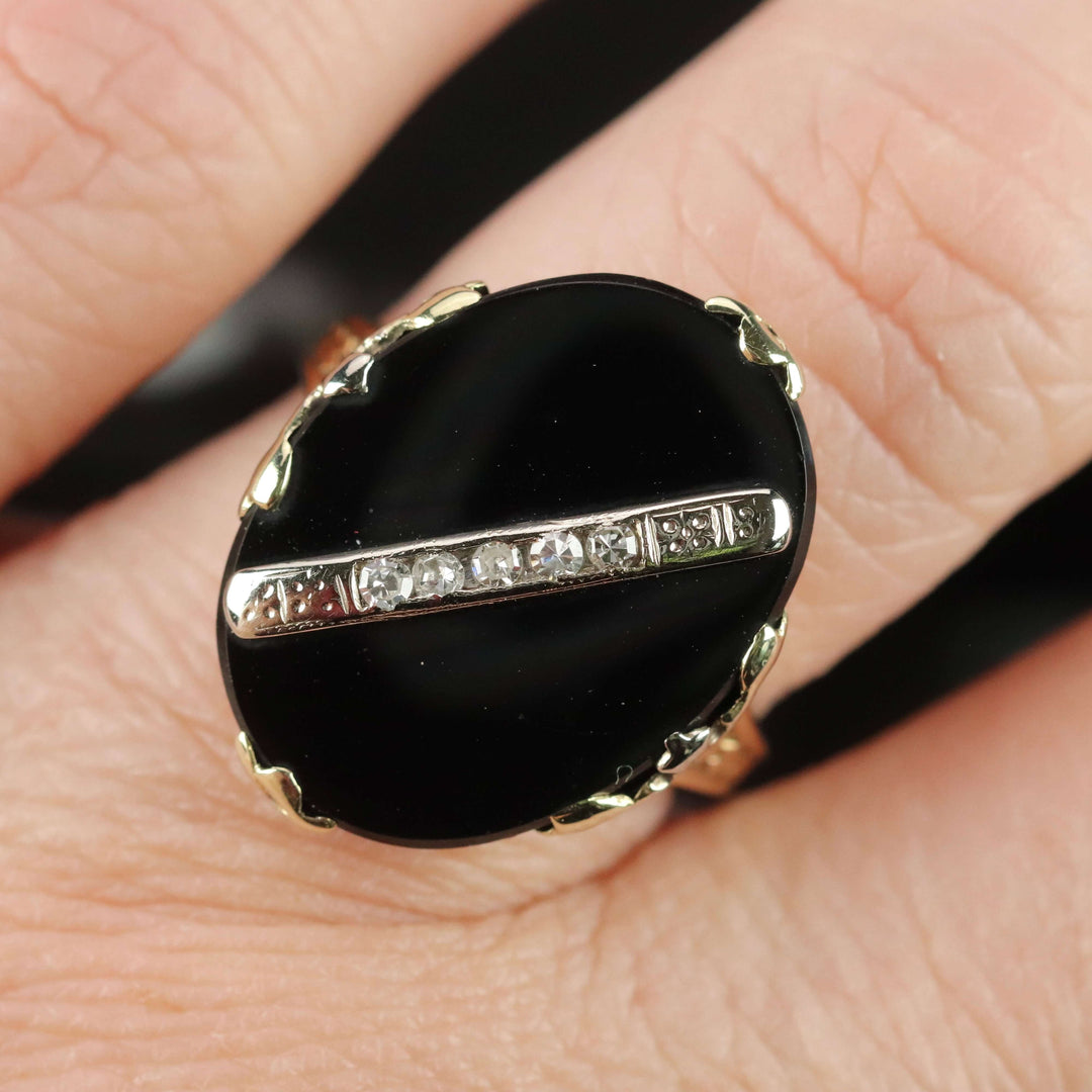 Vintage onyx and diamond ring in yellow gold