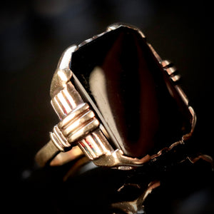 Heavy vintage onyx ring in yellow gold