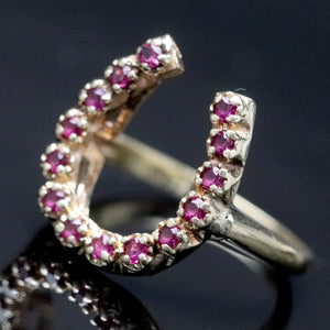 Vintage ring with synthetic rubies in a horseshoe shape in yellow gold