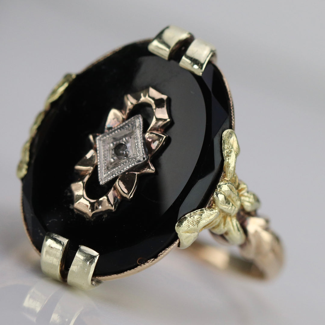 Vintage onyx and diamond ring in yellow gold