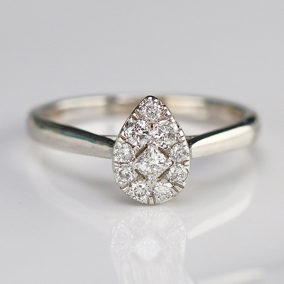 Pear shape diamond cluster ring in 14k white gold