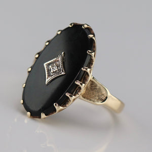 Classic vintage onyx and diamond ring in yellow gold