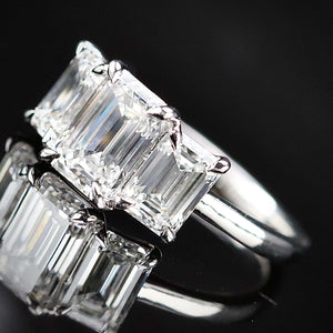 MANOR ROYAL:  The Charlotte - 3 stone 3.03ctw lab grown emerald cut diamond ring in platinum