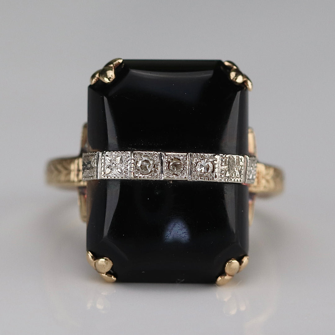 Vintage onyx and diamond ring in yellow gold