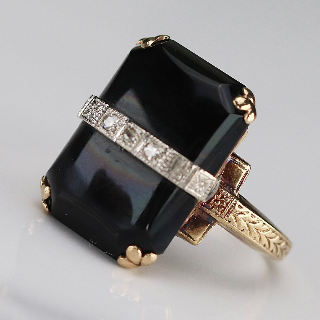 Vintage onyx and diamond ring in yellow gold