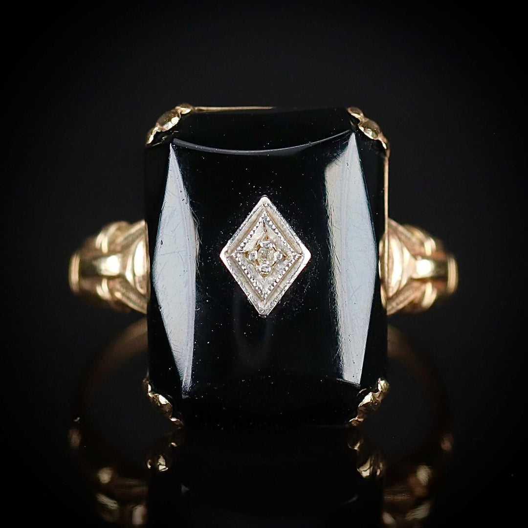 Vintage faceted Onyx and diamond ring in yellow gold