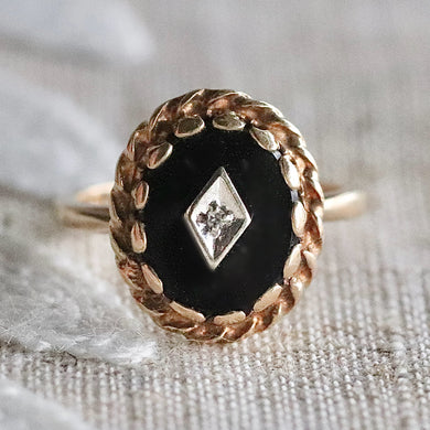 Classic vintage onyx and diamond ring in yellow gold