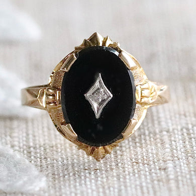 Classic vintage onyx and diamond ring in yellow gold