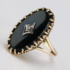 Classic vintage onyx and diamond ring in yellow gold