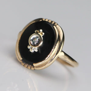 Vintage oval onyx and diamond ring in yellow gold