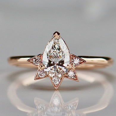 Pear shaped lab grown diamond and earth mined diamond ring in 14k rose gold