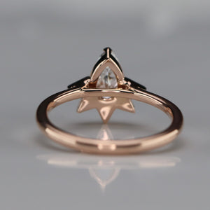 Pear shaped lab grown diamond and earth mined diamond ring in 14k rose gold